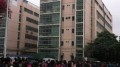 Workers stand at the top of a building threatening to jump, courtesy of  http://lc.cf8.com.cn