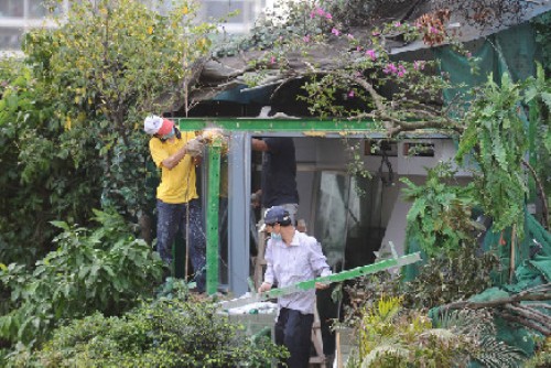 guangzhou illegal structure penthouse treehouse tianhe demolition extra stories